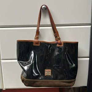 Dooney & Bourke black patterned leather tote bag. Red insides.